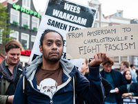 Demonstrators march with a banner during a protest called by the Dutch Antifascist Action AFA (Anti Fascistische Actie) against the violence...