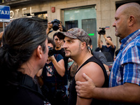 A far-right sympathiser argues with anti-fascist activists during the vigil that took place in las Ramblas of Barcelona on 18 August, 2017,...