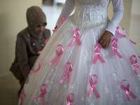 A Palestinian group of youth  campaigning for cancer patients. Gada Bin Said, Naherl Aldreemly and artist Mariam Salah made a piece of art e...