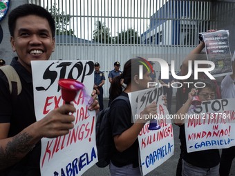 Protesters holding placards ring bells during a rally against the recent killing of 17 year old Grade 11 student Kian Lloyd Delos Santos on...