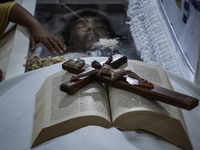 A bible and a crucifix is seen on top of the coffin of Kian Loyd Delos Santos during his funeral rites in Caloocan, Metro Manila, Philippine...