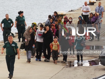 Bulgarian Border Police and Red Cross officers stang guard and comforts illegal emigrants from Iraq, Afghanistan, Syria and other countries...