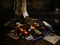 People display flowers, messages and candles to pay tribute to the victims of the Barcelona and Cambrils attacks in Cambrils on August 26, 2...