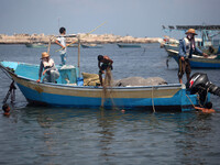 Palestinian fishermen during fishing in the port of Gaza  on August 17, 2014 .Israeli Prime Minister Benjamin Netanyahu  Israel will not agr...