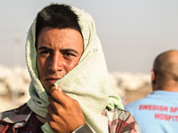 Yazidi refugees enter Zakho Iraq, thousands have crossed the Tigris river form Syria to come to the UN camps being set up across Dohuk. The...