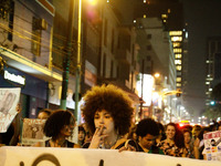 Women perform on Paulista Avenue, downtown São Paulo, Brazil, on August 29, the date of the first National Lesbian Seminar, organized by the...