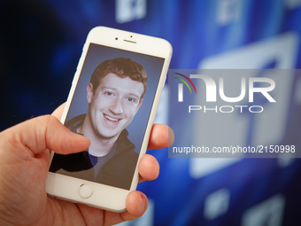 A portrait of Facebook found Mark Zuckerberg is seen on an iPhone in this photo illustration on 28 August, 2017. (