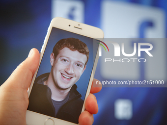 A portrait of Facebook found Mark Zuckerberg is seen on an iPhone in this photo illustration on 28 August, 2017. (