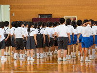 Elementary students gather in the school gym after a loud siren warning during an evacuation drill in preparation for a North Korea'n ballis...