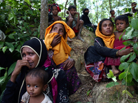 Rohingya people sits on the Bangladesh side as they are restricted by the members of Border Guards Bangladesh (BGB), to go further inside Ba...