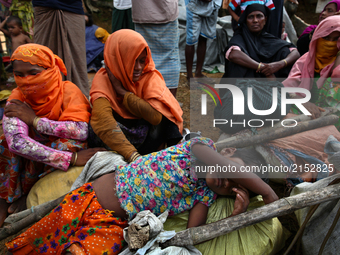 New Rohingya refugees sit near the Kutupalang makeshift refugee camp, in Cox’s Bazar, Bangladesh  on 30 August 2017. UN refugee agency said...