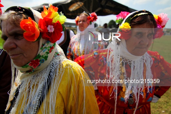 Bulgarian dancers wear Bulgarian national traditional clothes during an annual folklore festivity in the Bulgarian village of Benkovski, eas...