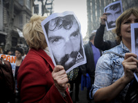 People hold photos of Santiago Maldonado, who's missing, during a demonstration at Plaza de Mayo on Sep. 1, 2017 in Buenos Aires, Argentina....