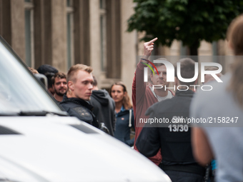 A right-wing counter protester shows the middle finger in the direction of the demonstration  in Wurzen, Germany on 2 September 2017. About...