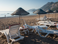 An empty beach and empty beach chairs near the scenic Mount Olympos in Cirali, Turkey in the early morning on 3 September 2017.  Turkey's to...