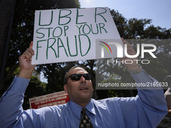 Uber and Lyft drivers protest the ride sharing companies' low wages in Los Angeles, California on September 5, 2017.(Photo by: Ronen Tivony)...