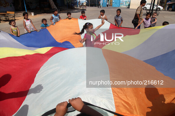 Palestinian children  as they participate in a recreational activity at a UN school  in the Shati refugee camp west of Gaza City in the Gaza...
