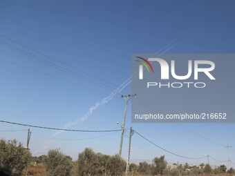 Smoke trails are seen as a rocket is launched from the east Gaza City towards Israel on August 19, 2014. . Israeli and Palestinian negotiato...