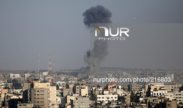 Smoke is seen after what witnesses said was an Israeli air strike in Gaza City August 19, 2014. Israel launched attacks in the Gaza Strip on...