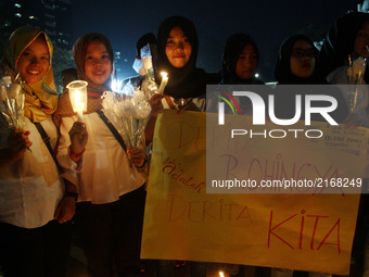 Dozens of Islamic students staged a joint prayer action as they solidarity to the Rohingya people in front of the National Monument, Jakarta...