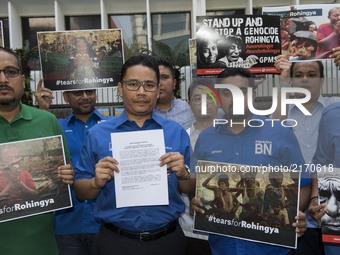 Khairul Azwan Harun(Cnter, 41, politician) who Deputy Leader of UMNO(United Malays National Organisation) Youth and UMNO members picket outs...