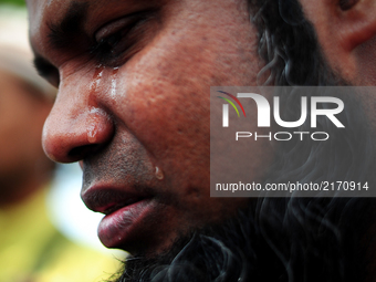 A ethnic Rohingya man cries during a protest of the genocide of Ethnic Rohingya Muslims in Myanmar, in George Town, Penang on September 8, 2...