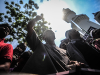 A man raised his hand during a protest of the genocide of Ethnic Rohingya Muslims in Myanmar, in George Town, Penang on September 8, 2017. N...