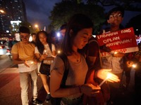 Protesters hold candles during a rally against extrajudicial killings allegedly done by government forces and vigilantes in Manila, Philippi...