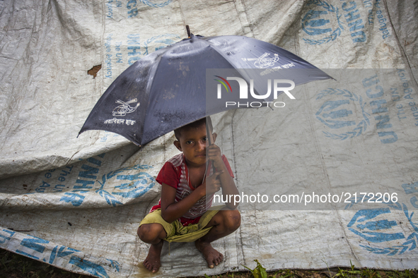 A Rohingya ethnic minority girl waiting at a temporary makeshift camp after crossing over from Myanmar into the Bangladesh side of the borde...