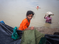 Rohingya ethnic minority people crossing the Naf river for temporary makeshift camp after crossing over from Myanmar into the Bangladesh sid...