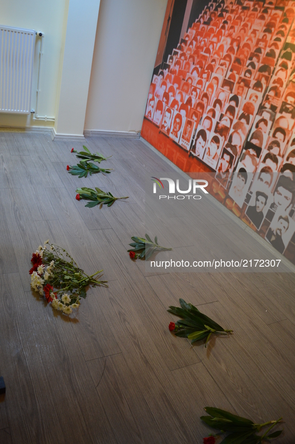 Flowers are placed on the floor on the opening day of the September 12 Shame Museum, which is held with the help of the main opposition Repu...