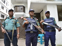 Bangladeshi Police stand guard in front of Myanmar Embassy in Dhaka, Bangladesh, on September 10, 2017  Tens of thousands more people have c...