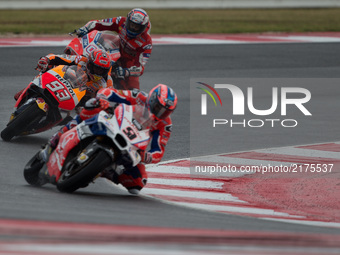 Danilo Petrucci of OCTO Pramac Racing and Marc Marquez of Repsol Honda Team challenge for the first position during the Race of the Tribul M...