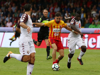 Player of Benevento Calcio Marco D'Alessandro vies with Torino FC Acquah Afriyie during the Serie A match between Benevento Calcio and Torin...