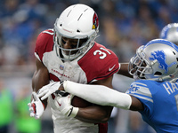 Arizona Cardinals running back David Johnson (31) is tackled by Detroit Lions defensive back D.J. Hayden (31) during the second half of an N...