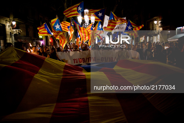Pro independentist supporters wave estelada flags (Catalonia independence sign) the eve of La Diada or Catalan National Day on Sept. 10, 201...