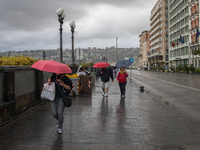 The tourists in Golfo of Naples, Via Partenope, View of Rain and Storm to Naples, Italy on 11 September , 2017. Some storms will produce hea...