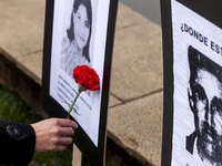 Osorno, Chile. 11 September 2017. Relatives of disappeared detainees with red carnations. Relatives of the Disappeared, former political pri...