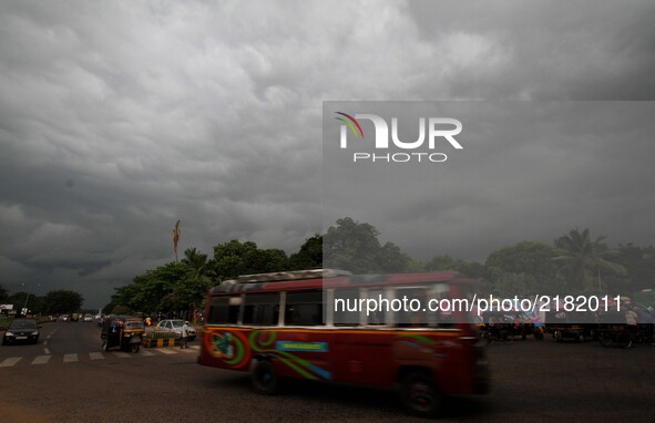 Rain clouds hover in the sky before downpour in the eastern Indian state Odisha's capital city Bhubaneswar on 13 September 2017.  