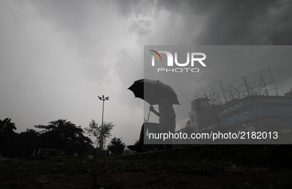 Rain clouds hover in the sky before downpour in the eastern Indian state Odisha's capital city Bhubaneswar on 13 September 2017. 