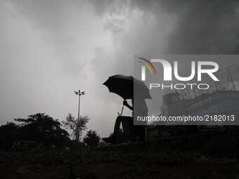 Rain clouds hover in the sky before downpour in the eastern Indian state Odisha's capital city Bhubaneswar on 13 September 2017. (