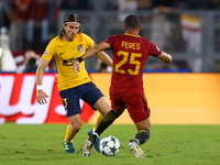
Filipe Luis of Atletico tackling on Bruno Peres of Roma  during the UEFA Champions League Group C football match between AS Roma and Atleti...