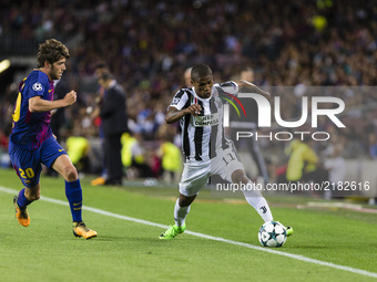Douglas Costa and Sergi Roberto during the match between FC Barcelona - Juventus, for the group stage, round 1 of the Champions League, held...