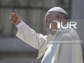 Pope Francis gestures as he leaves at the end of his Weekly General Audience in St. Peter's Square in Vatican City, Vatican on September 13,...
