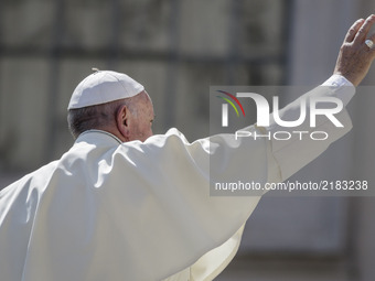 Pope Francis greets the faithful as he leaves at the end of his Weekly General Audience in St. Peter's Square in Vatican City, Vatican on Se...