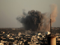  	Smoke rises following what witnesses said was an Israeli air strike in Gaza August 20, 2014. Arab League chief Nabil al-Arabi accuses Isra...