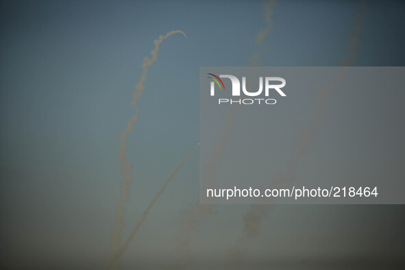 Smoke trails are seen as rockets are launched from the Gaza Strip towards Israel August 20, 2014.Abu Ubaida, the spokesman of the Izz el-Dee...
