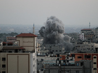 Smoke rises after Israeli air strikes in Gaza City, on 20 August 2014. (