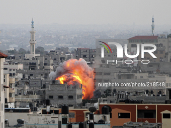 Smoke and fire after an Israeli air strikes over Gaza City, on 20 August 2014. (