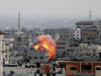 Smoke and fire after an Israeli air strikes over Gaza City, on 20 August 2014. (